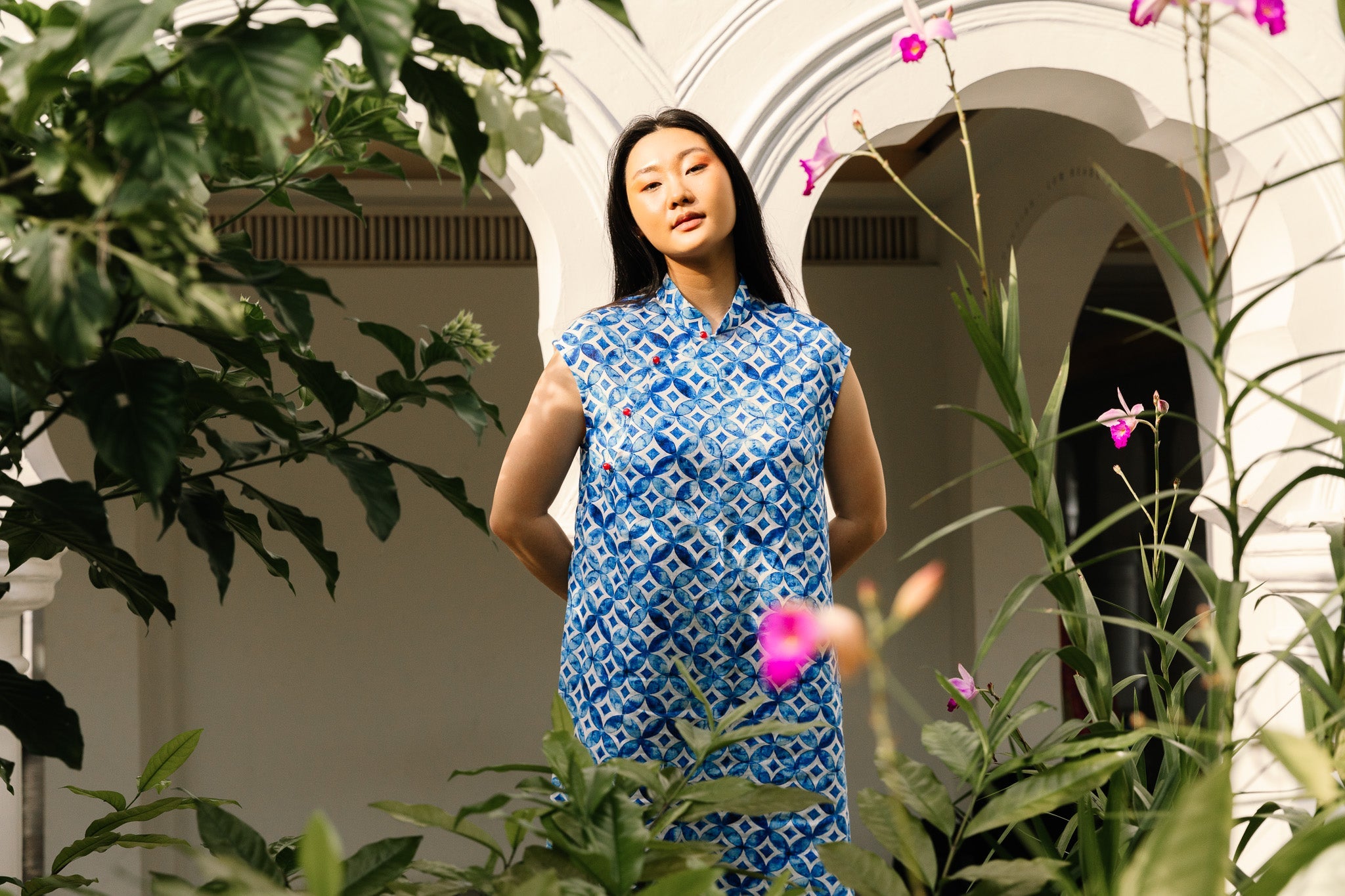 Women's cheongsam dress by local designer You Living, worn outdoors in Singapore 