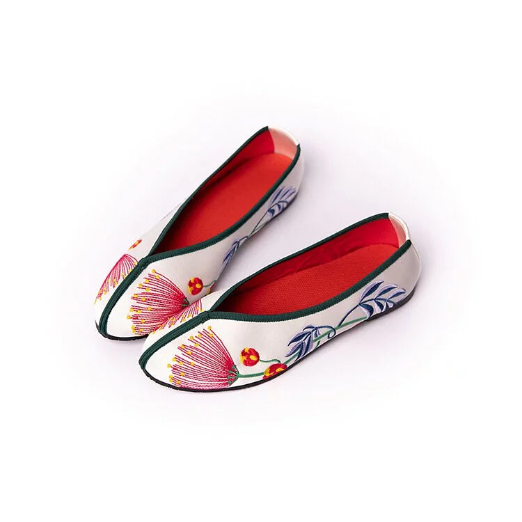 White shoes with embroidered 2025 flowers